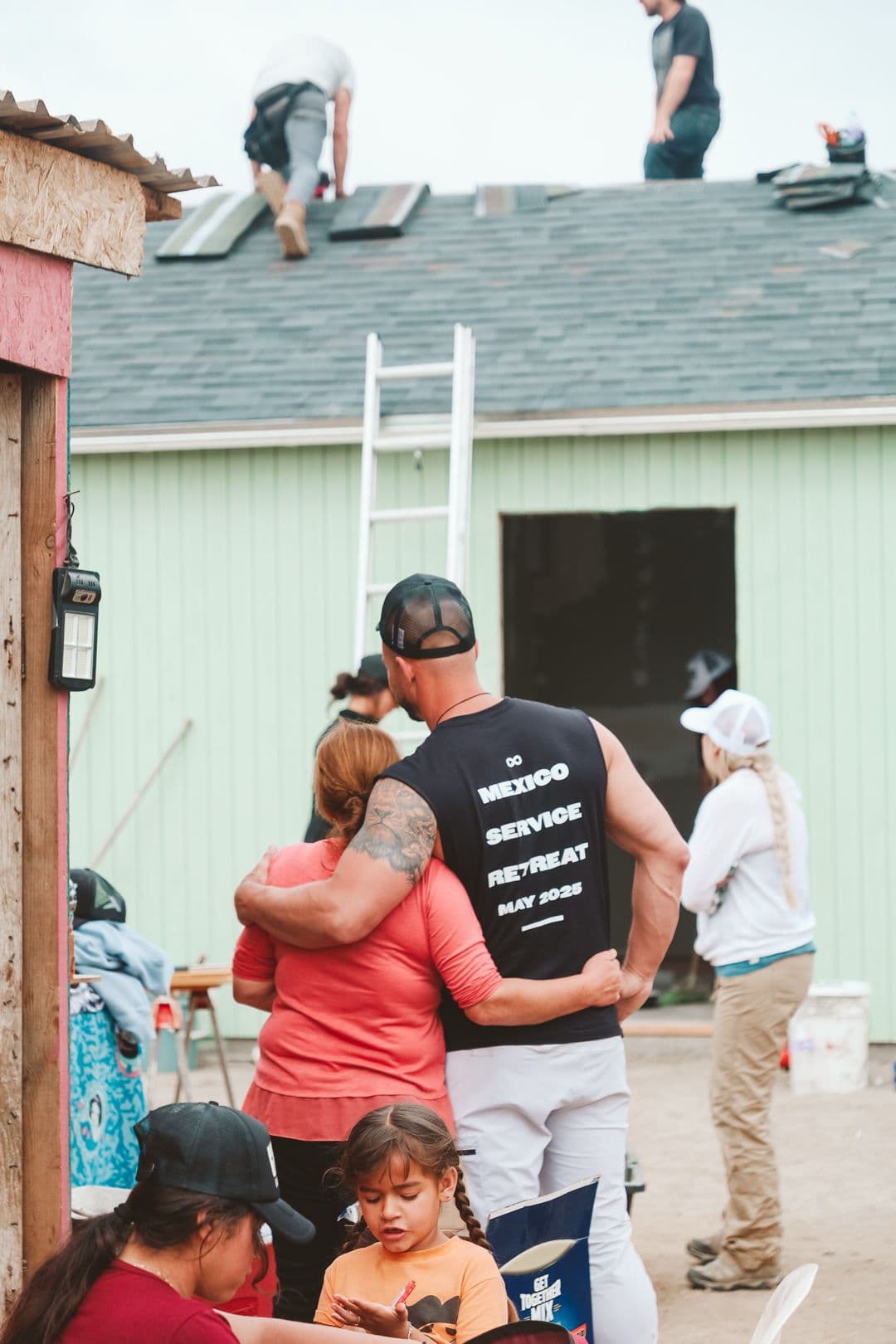 Garin embracing a community member at the retreat